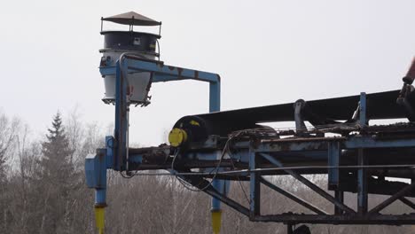 sand and stone belt rolling in an industrial factory