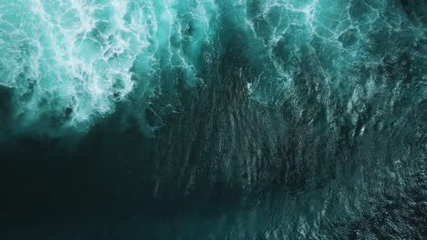 aerial view of powerful ocean waves crashing