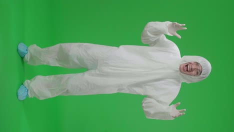 full body of asian man wearing personal protective equipment uniform ppe surprise and say wow in the green screen studio
