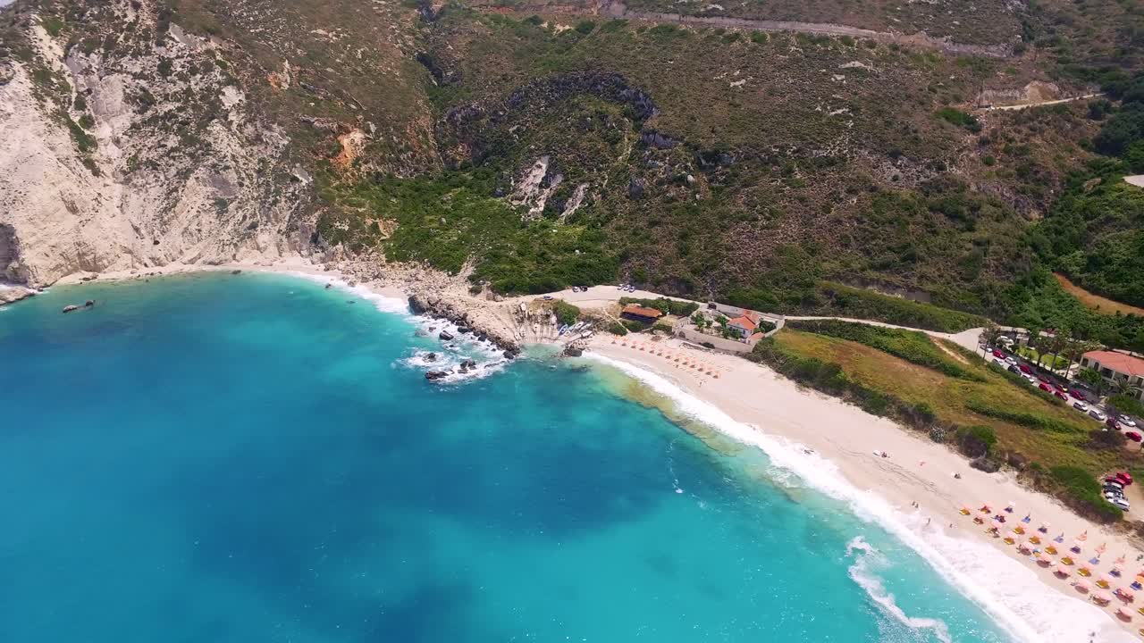 Panning drone shot of the whole stretch of Petanoi beach resort, a secluded getaway in the island of Kefalonia in the Western Coast of Greece