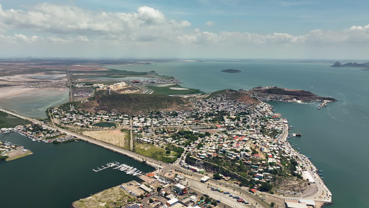 Aerial view backwards over the Topolobampo town, sunny day in Sinaloa, Mexico