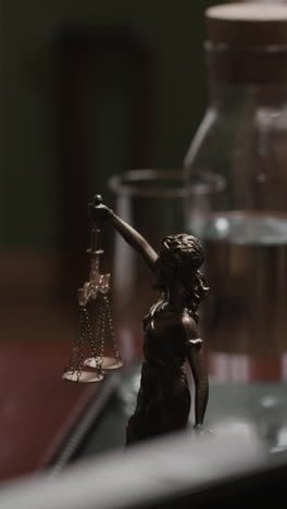 lady justice statue on a desk
