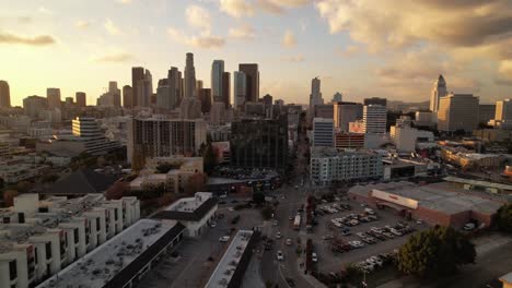 aerial push in to los angeles skyline at sunset