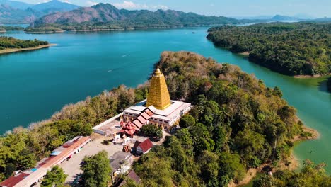 golden pagoda on lake near the border of myanmar