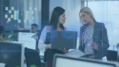 discussing work, businesswomen with digital data overlay animation in modern office setting