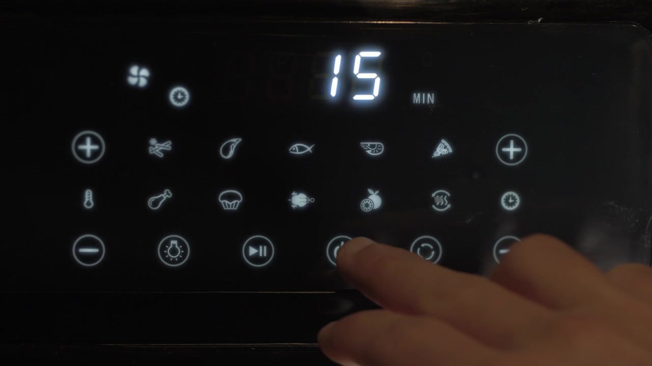 Pressing settings on air fryer display