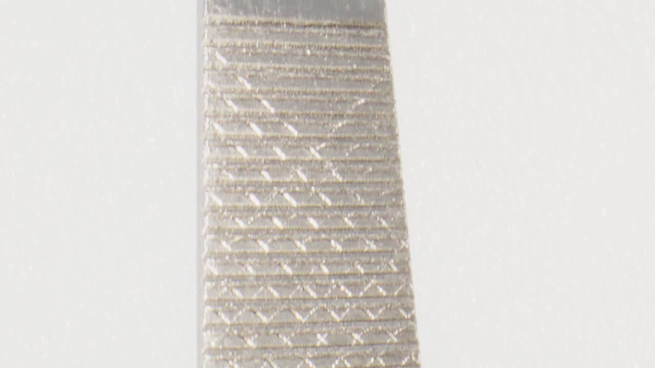 Macro view close up nail file with camera moving up