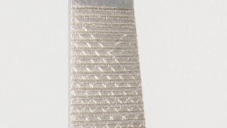 Macro-view-close-up-nail-file-with-camera-moving-up