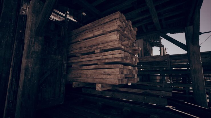 Stacks of wooden planks stored in a rustic warehouse during daylight