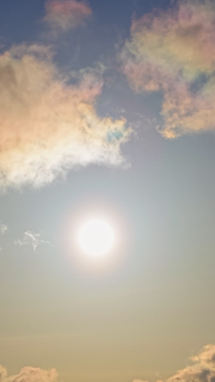 Aerial drone view of the sun peaking through the clouds