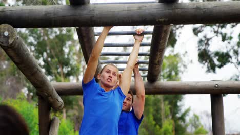 Fit people climbing monkey bars 4k