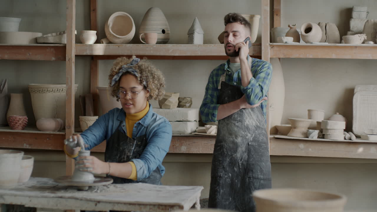 Potters at Work in a Studio