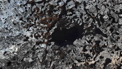 aerial top down shot of ice floe pattern on sea in winter during daytime,iceland - orbit overhead shot