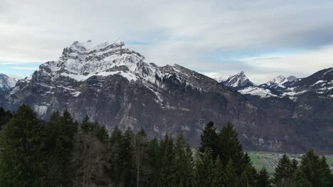 Fronalpstock-Glarus-Switzerland-slow-reveal-of-village-in-the-valley