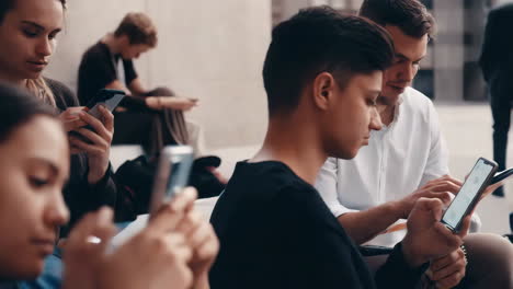 people engaged in phones in a gathering