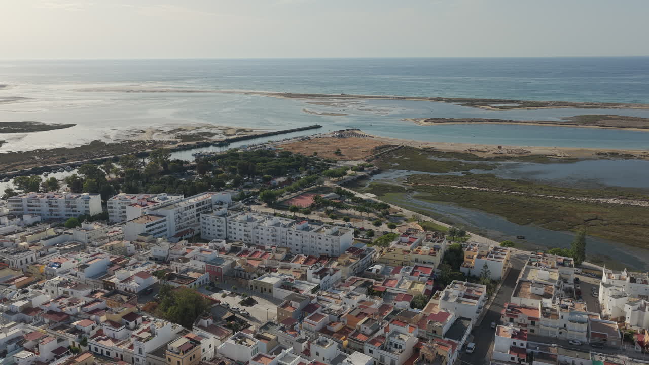 Drone advances over Fuseta toward Ria Formosa shoreline