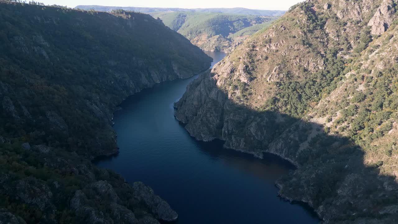 Sweeping drone view of Galicia’s Cañón del Río Sil, river flows through dramatic canyon walls in Spain