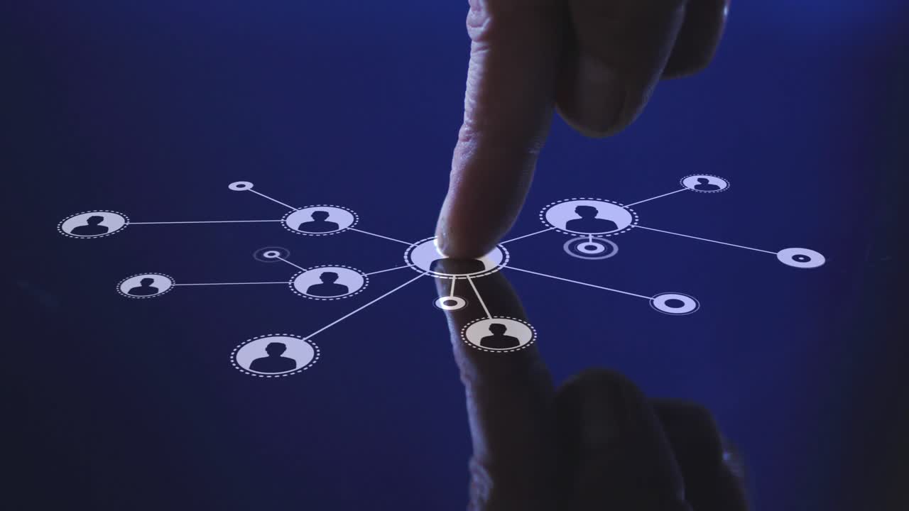 Animation of man's finger touching interactive screen with network of icons