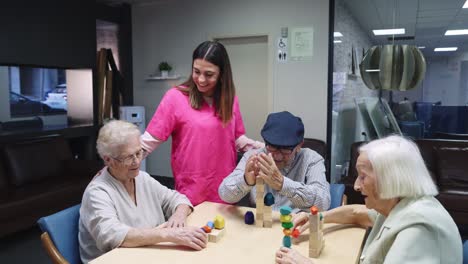 elderly caregivers playing with wooden blocks