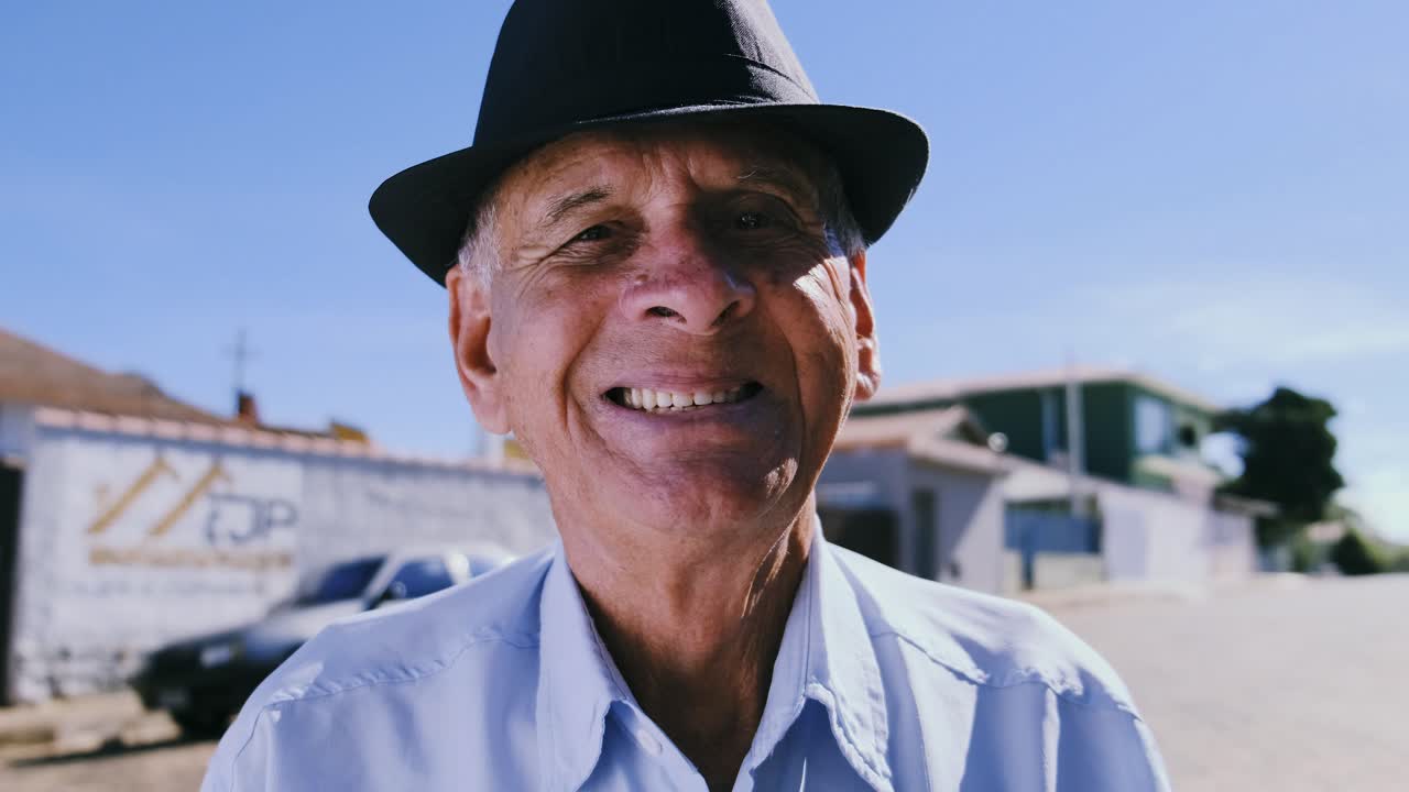 Portrait of a Smiling Senior Man in a Hat