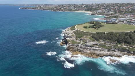 dangerous waves crashing on rocky inlet at mackenzies point peninsula - tamarama beach, sydney nsw, australia