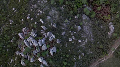 Topdown-view-Along-Rocky-landscape-of-Peneda-Gerês-mountain-with-rural-road,-Portugal