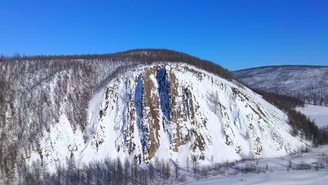 drone flyover near a beautiful mountain in winter