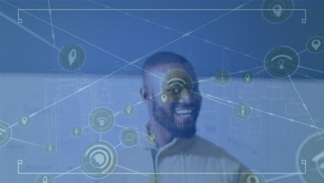animation of network of connections with icons and digital city over african american male teacher