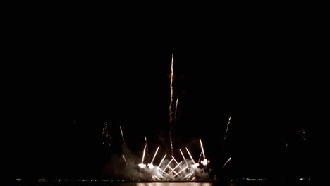 Abstract-colored-real-firework-background-with-big-shining-glowing-fireworks-show-with-bokeh-lights-in-the-night-sky