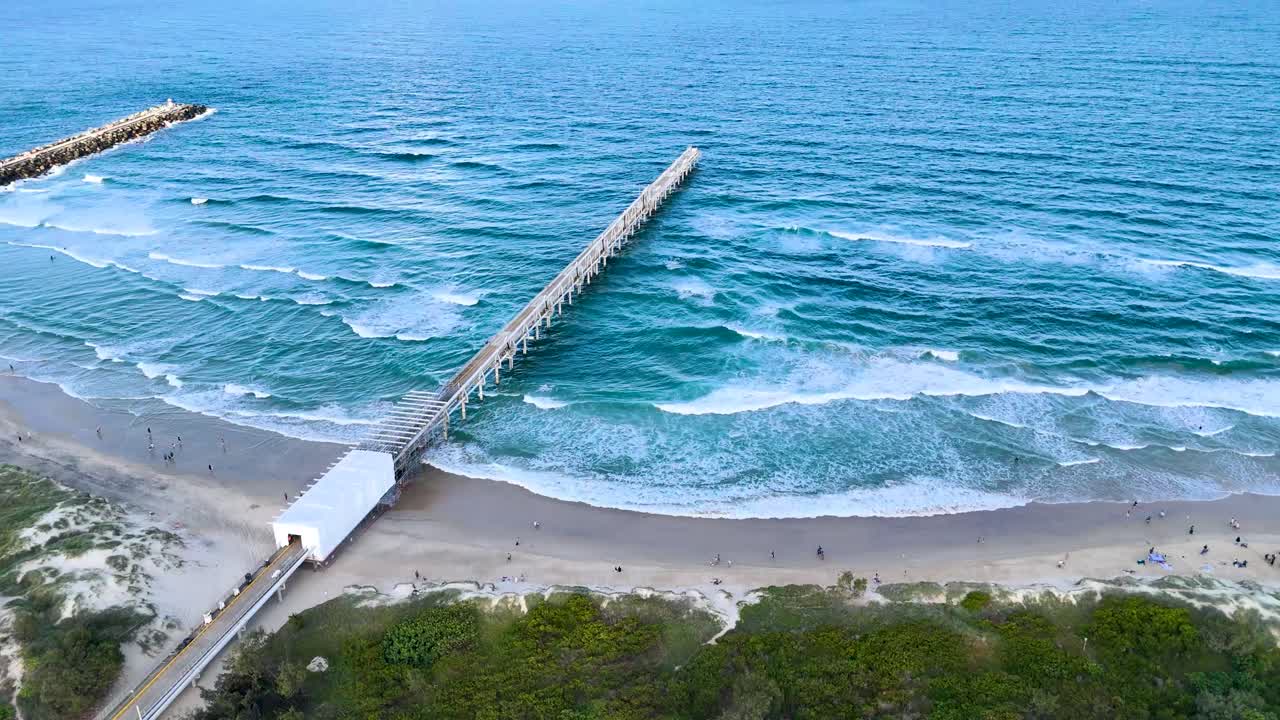 Drone captures waves and pier at Gold Coast
