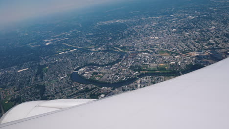 The-Airliner-Begins-To-Land-Over-New-York-A-Spectacular-View-Of-The-City-In-The-Foreground-The-Wing-