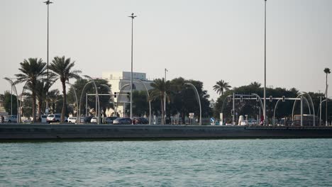 coastal cityscape with palm trees and traffic