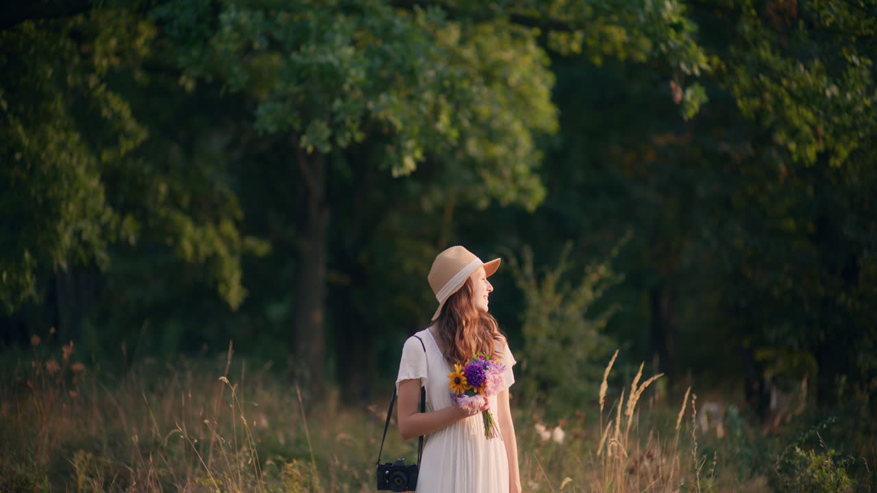 Thoughtful girl in white dress at sunset
