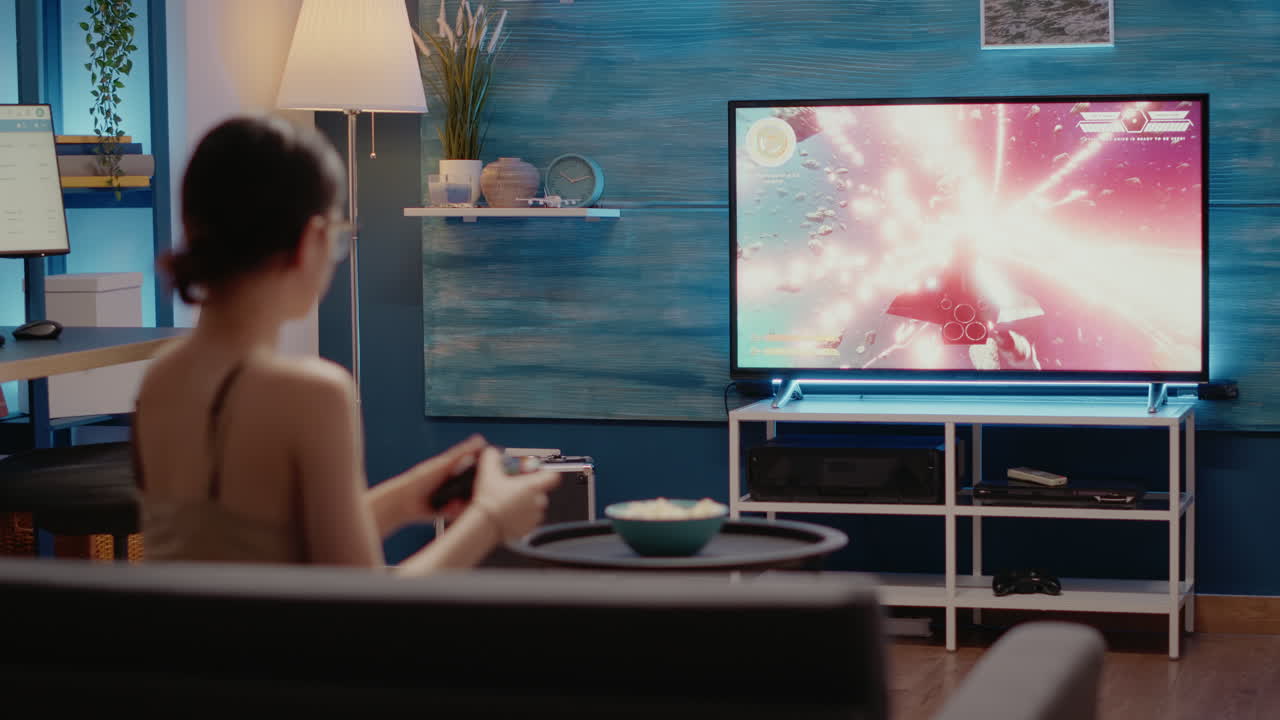 Caucasian woman losing while playing video games holding modern controller