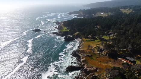 Drone-video-of-the-ocean-meeting-the-coastline-at-Bodega-Bay-and-Gualala-Coast,-California