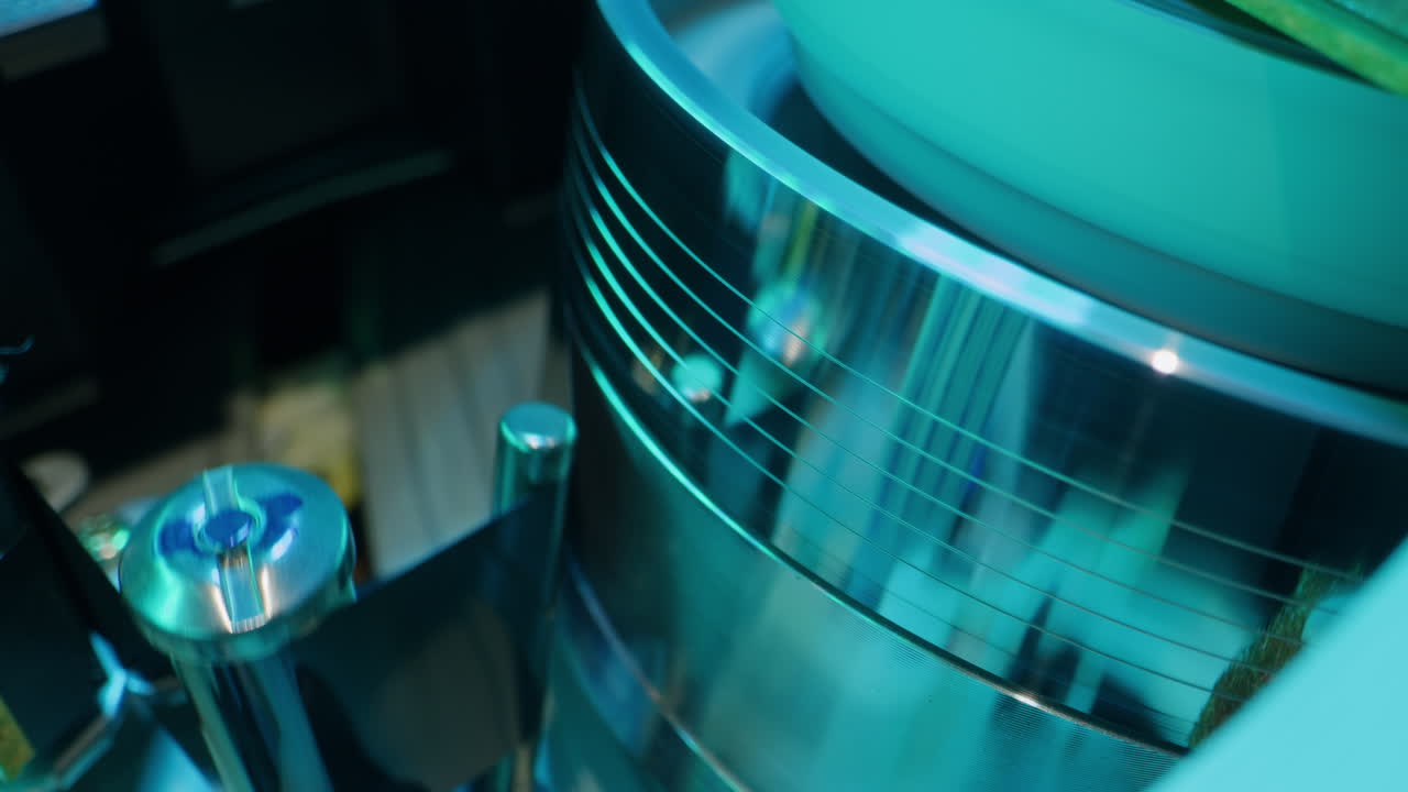 Old video recorder inside close-up, VHS. Retro player in neon blue light, vintage video cassette broadcasting, audio tape.