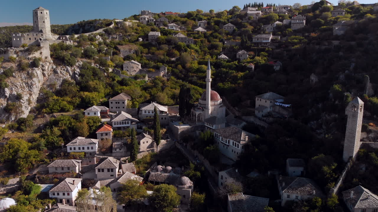 Beautiful Počitelj mountainside village mosque, Bosnia and Herzegovina, aerial