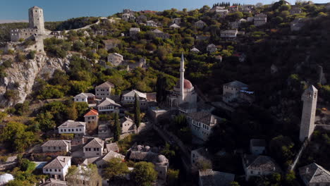 beautiful počitelj mountainside village mosque, bosnia and herzegovina, aerial