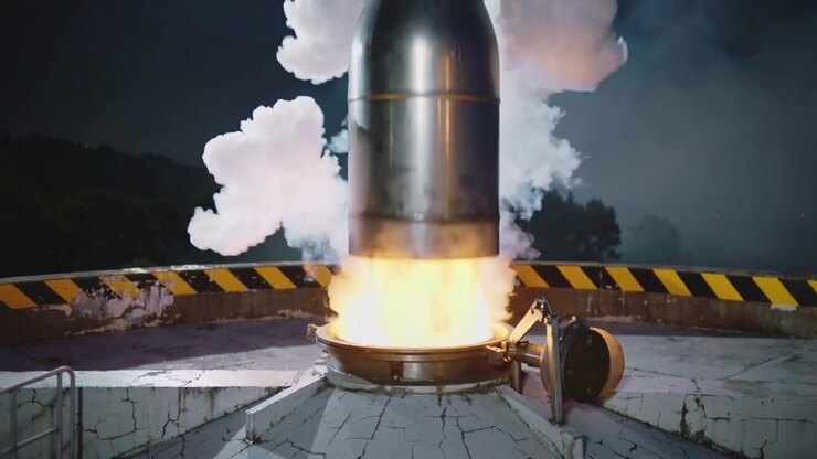 Igniting charge, metallic hatch lifting on rooftop, activating actuator, ejecting cylinder plume