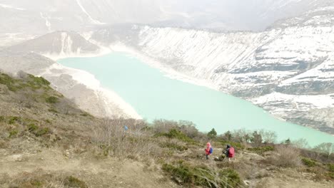 couple backpackers do acclimatization near lake birendra in nepal. manaslu area.