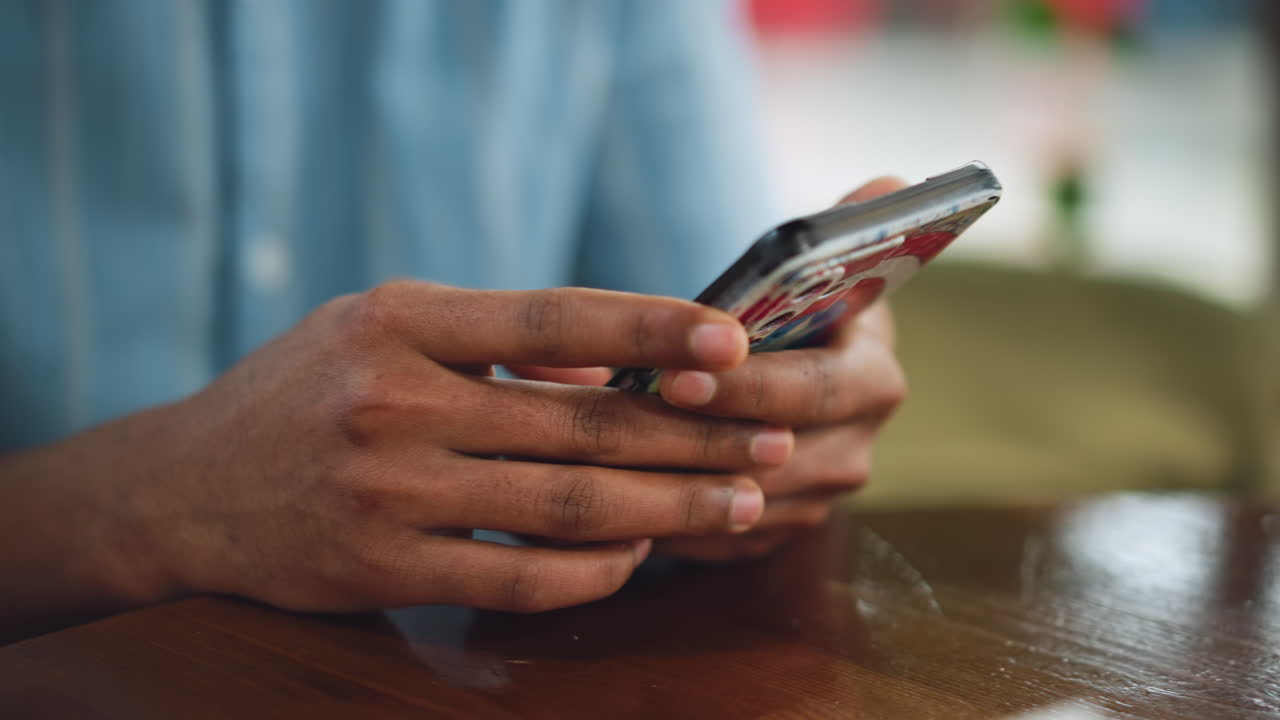 Good looking fingers cloaked together holding mobile phone at center, closeup of grip from both sides, soft focus background, subtle light reflection on screen, intimate tech interaction