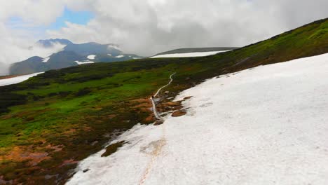 daisetsuzan national park drone flight, hiking on the trail through the ice and snow