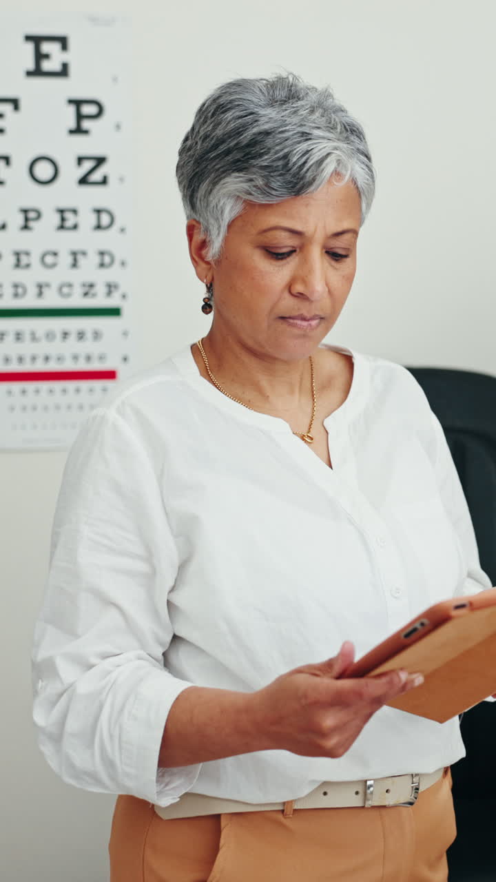 Woman using an iPad in an optometry setting