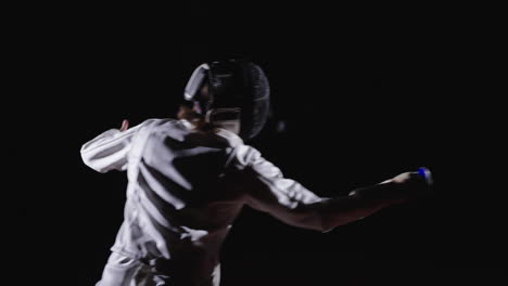 fencer in action during a competition