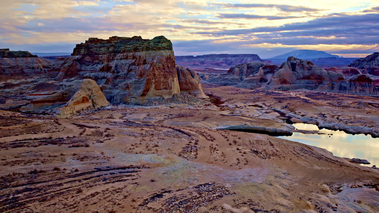 A sweeping aerial view capturing the surreal beauty of the red rock desert landscape near Lake Powell.