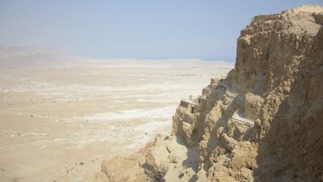 The-view-from-the-ancient-fortress-of-Masada,-looking-down-across-the-desert-to-the-Dead-Sea