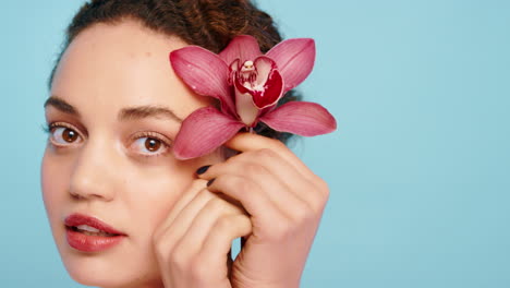 beauty, skincare or face of woman with flower