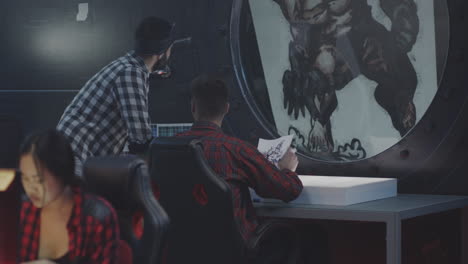 team of graphic designers working on a new character design