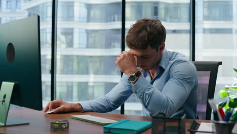 despaired manager disappointed work failure closeup. nervous man using computer