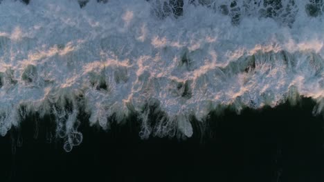 Overhead-aerial-drone-of-ocean-wave-on-dark-sea